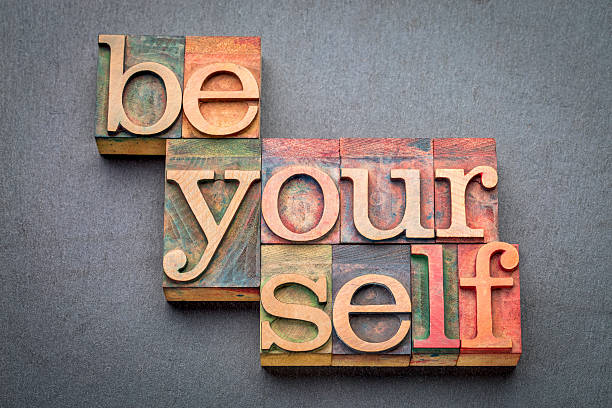 istock be yourself word abstract in wood type 611176832