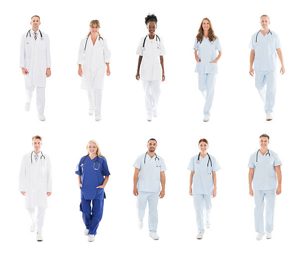 istock Doctors With Medical Workers Walking Against White Background 611177330