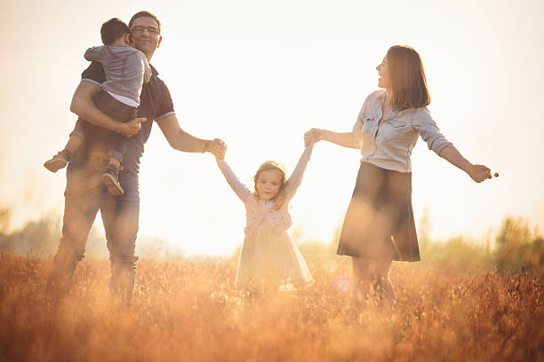 istock Happy family outdoors having fun 611177442