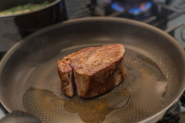 istock Fillet Steak cooking in a pan 611177490