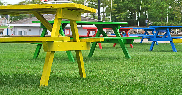 istock Colorful picnic tables - low view 611178212