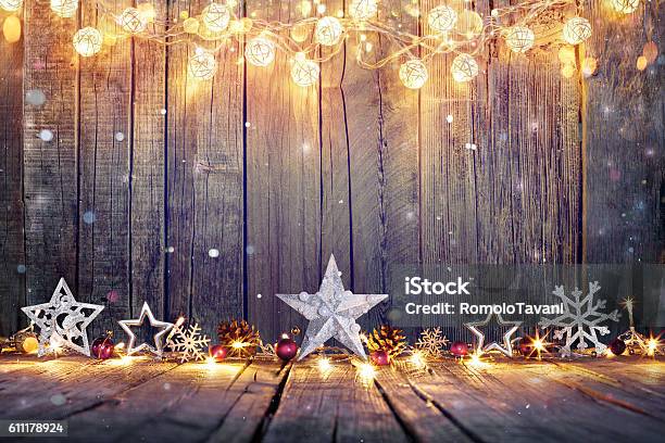 Vintage Christmas Card With Lights And Star On Table Stock Photo - Download Image Now