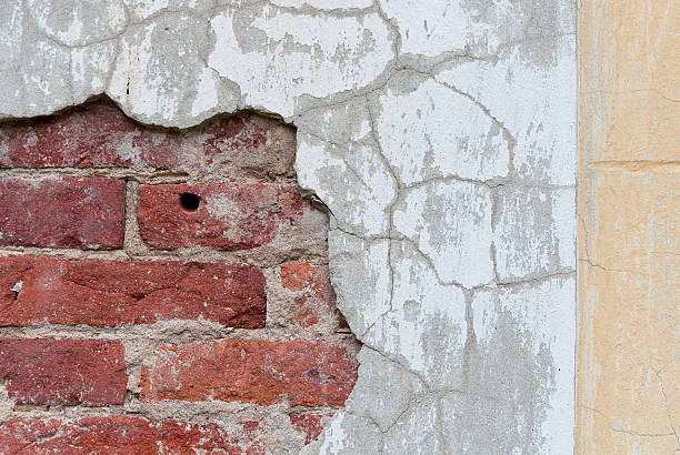 Old broken wall with visible bricks texture stock photo