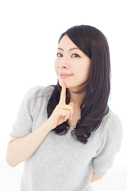 istock Japanese woman making gestures in white background 611179998