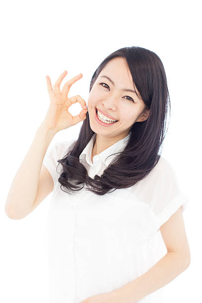 istock Japanese woman making gestures in white background 611180548