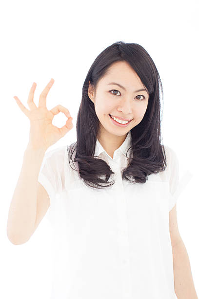 istock Japanese woman making gestures in white background 611180576