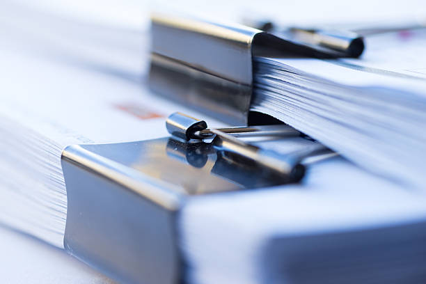 istock Piles of documents with black clip 611181336