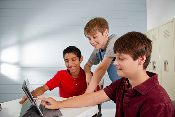 istock Pre-teenage friends using digital tablet, internet, social media. 611181568
