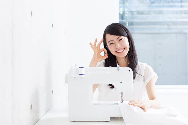 Sewing machine with thread on blurred background, macro view