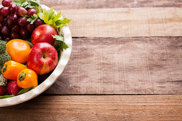 istock Organic colorful fruits, vegetables on rustic wooden table. 611182482