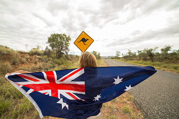 istock Female holds Australian flag neat Kangaroo sign 611183196