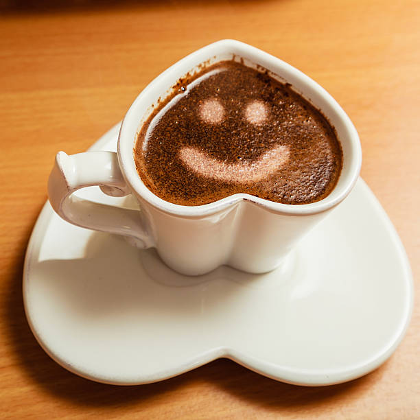 istock Coffee in heart shaped cup with smile face sign 611183776