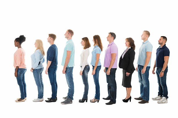 istock Side View Of Creative Business People Standing In Row 611183806
