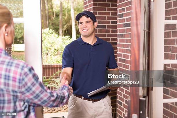 Repairman Or Delivery Person At Customers Front Door Stock Photo - Download Image Now
