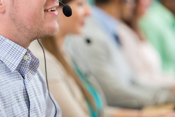 istock Caucasian male stock trader talks with client 611185346