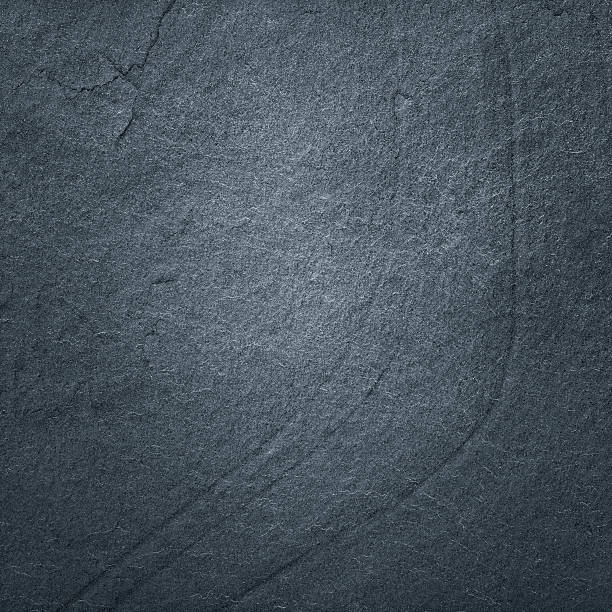 istock Dark grey black slate background or natural stone texture. 611185382