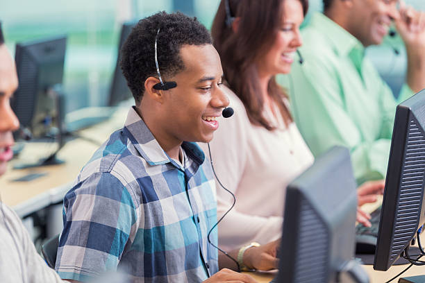 istock African American call center employee enjoys talking with customer 611185408