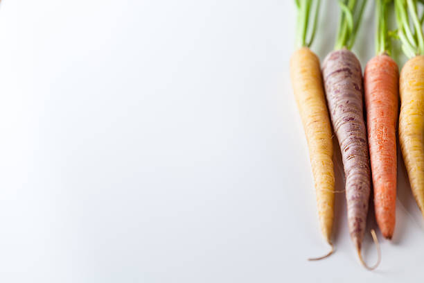 istock Fresh Organic Carrots Raw Colorful Bunch Isolated On White 611185762