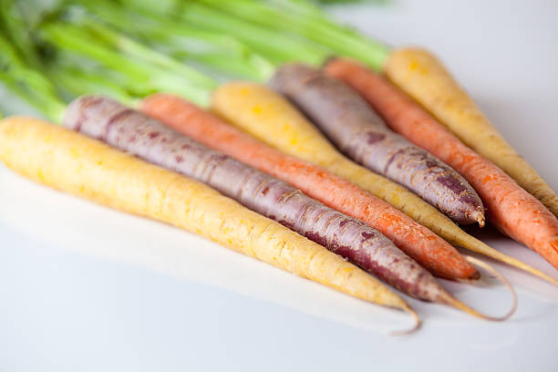 istock Fresh Organic Carrots Raw Colorful Bunch Isolated On White 611185868