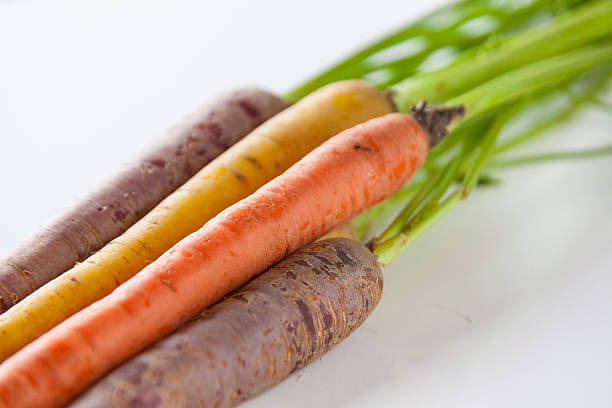 istock Fresh Organic Carrots Raw Colorful Bunch Isolated Close Up 611185962