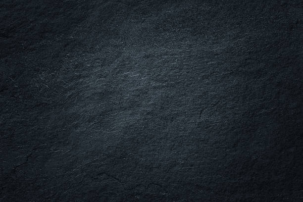 istock Dark grey black slate background or natural stone texture. 611186006