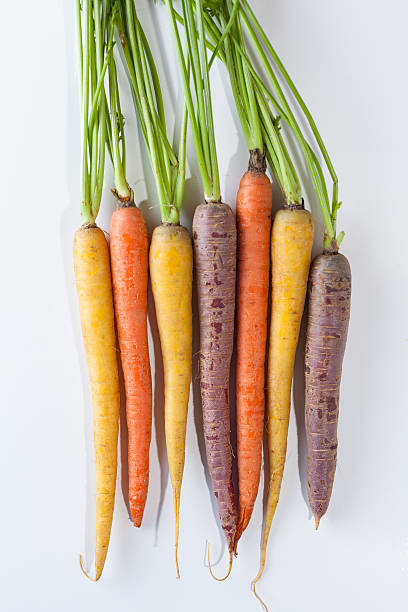 istock Fresh Organic Carrots Raw Colorful Bunch Isolated On White 611186136