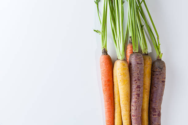 istock Fresh Organic Carrots Raw Colorful Bunch Isolated On White 611186142