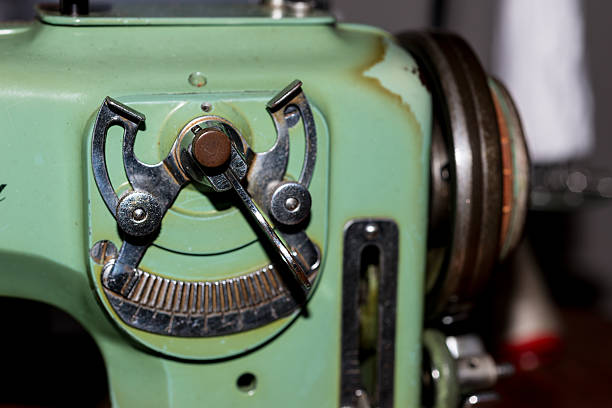 istock Senior woman with a sewing machine 611186294