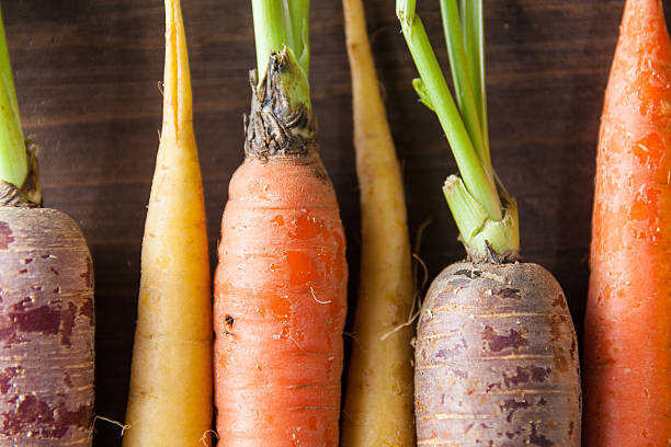 istock Organic Raw Carrots Close Up On Vintage Rustic Wood Texture 611186518