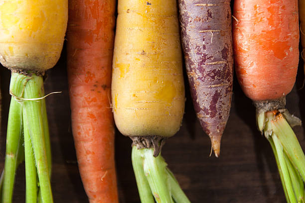 istock Organic Raw Carrots Close Up On Vintage Rustic Wood Texture 611186528