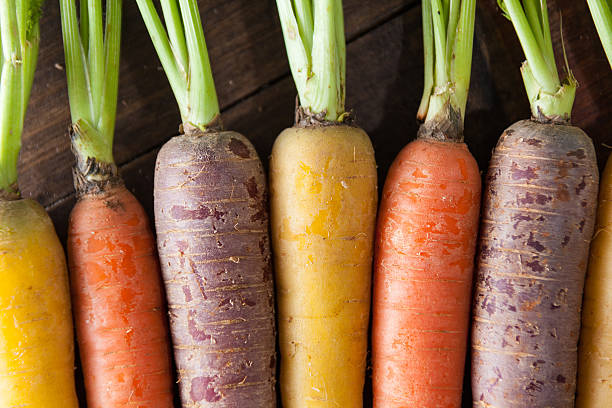 istock Organic Raw Carrots Close Up On Vintage Rustic Wood Texture 611186664