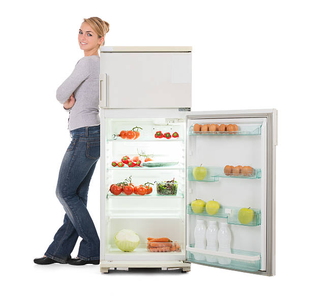 istock Woman With Arms Crossed Leaning On Open Refrigerator 611187044
