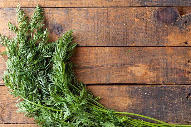istock Organic Raw Carrot Leaves On Vintage Rustic Wood Texture Table 611187632