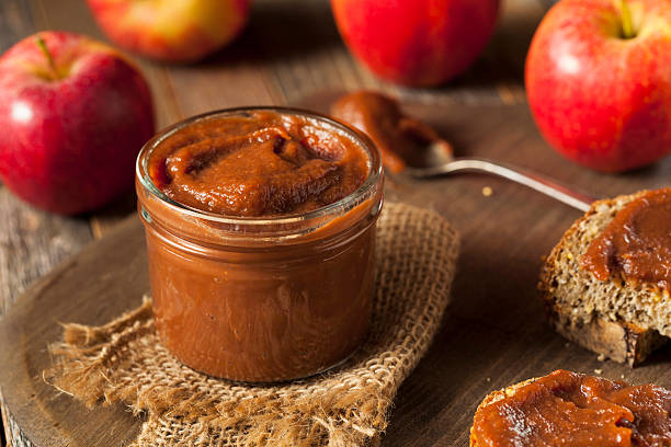 Homemade Sweet Apple Butter Homemade Sweet Apple Butter with Cinnamon and Nutmeg butter stock pictures, royalty-free photos & images