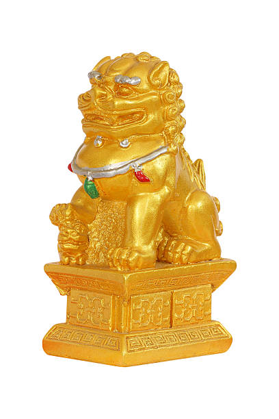 istock gold lion statue on white background. 611187894