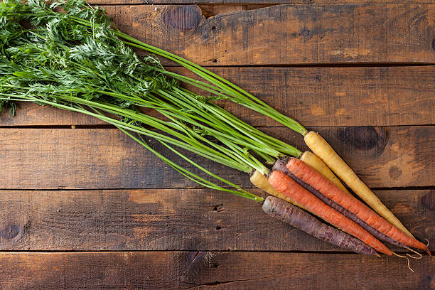 istock Organic Raw Carrots On Vintage Rustic Wood Texture Table Background 611188128