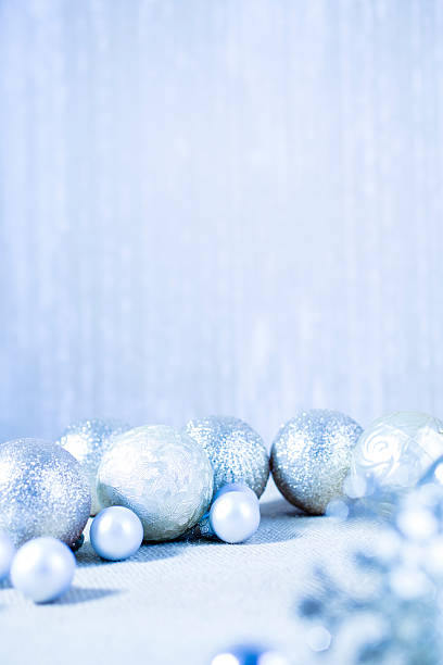 Christmas ornaments in silver and blue hues.