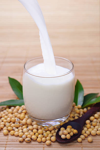 istock Pouring soy milk into clear glass 611189004
