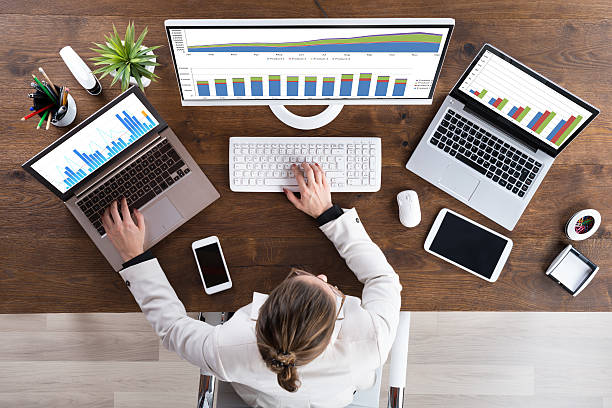 istock Businesswoman Working With Graphs On Computer 611189560