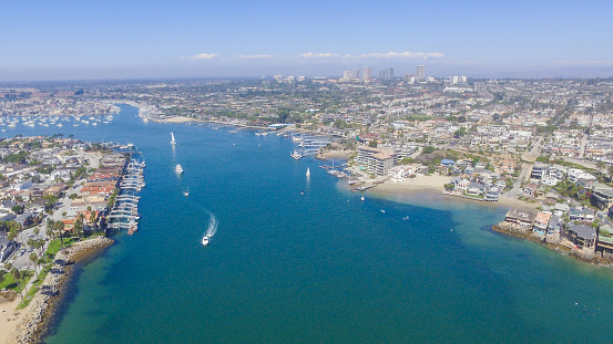 A view of the 'wedge' in Newport Beach and Newport Harbor, Southern California. The Wedge is a jetty that protects the Newport Harbor, as waves approach, the jetty funnels waves into double, even triple their size to create a unique and internationally popular surf destination.