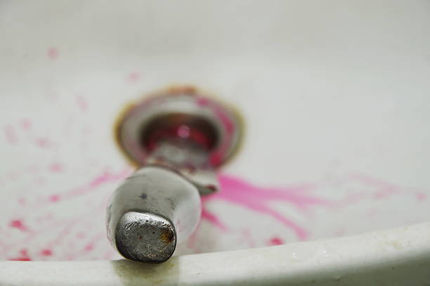 istock knife handle with blood splash on white ceramic sink bathroom 611192260