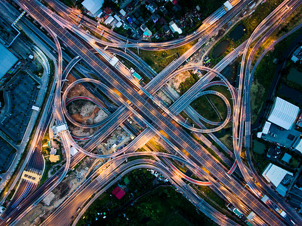 Highway junction from aerial view Highway junction in Bangna, the east of Bangkok from aerial view in the night. Taken in August 2016. bangkok street stock pictures, royalty-free photos & images