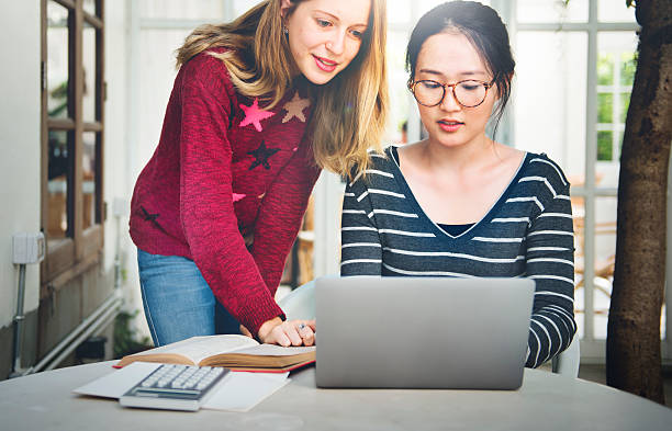 istock Women Friendship Studying Brainstorming Technology Concept 611192666