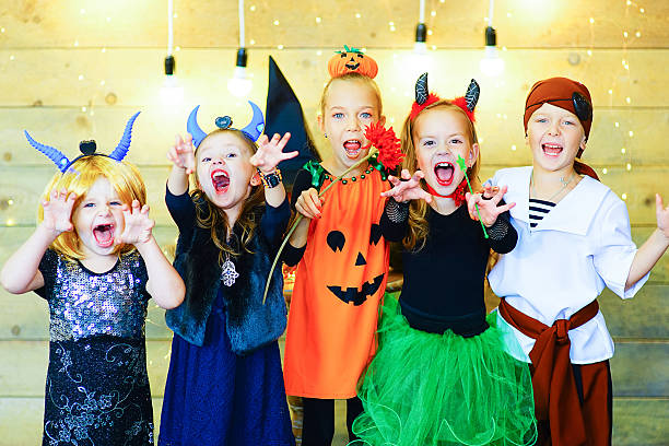 istock Happy group of children during Halloween party 611193128