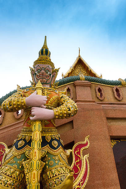 istock Giant statue in front of temple. 611196640