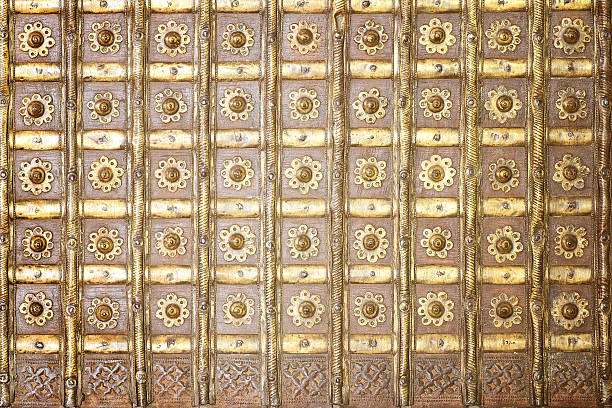 istock flowers metal pattern on dark wooden background. 611197070