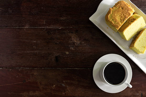 istock Coffee cup and saucer with cake 611197968