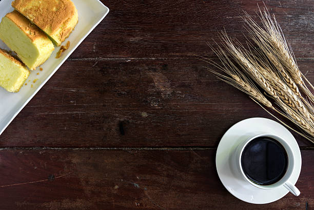 istock Coffee cup and saucer with wheat and cake 611197986