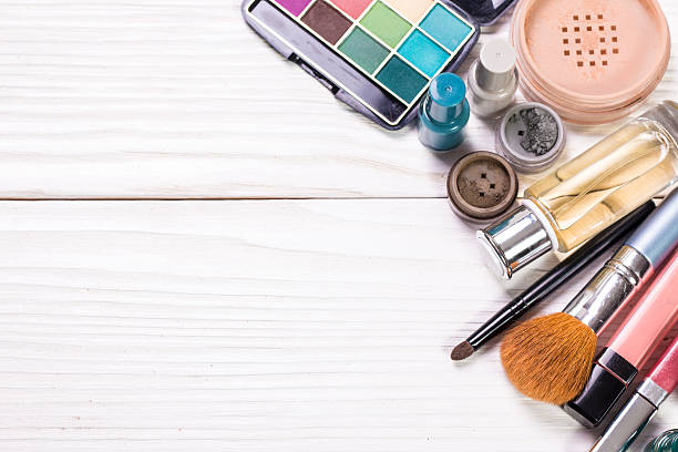 istock Various makeup products on wooden background with copyspace 611198320