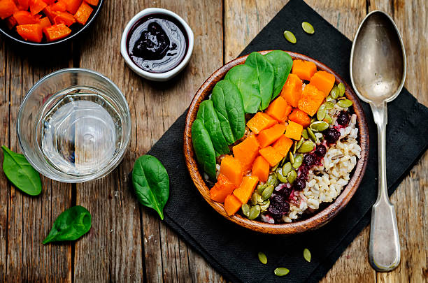 istock rice bowl with spinach, pumpkin, pumpkin seeds and cranberry sauce 611198400